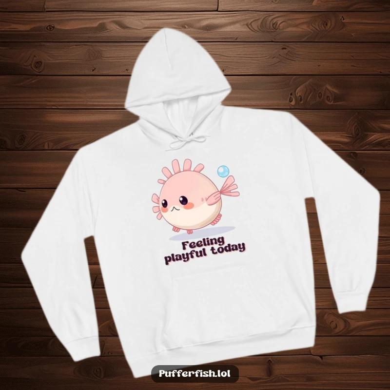 Funny Pufferfish Hoodie: A charming pufferfish playfully swims after a tiny sparkling bubble in the vast blue ocean, radiating happiness.