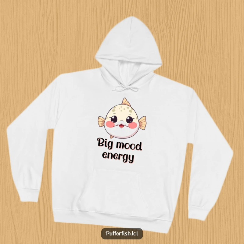 Funny Hoodie showing a tiny pufferfish inflating dramatically, cheeks puffed, eyes wide with playful surprise, cozy and comical.