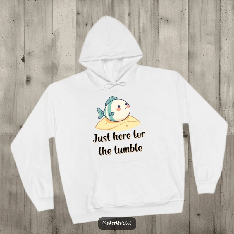 Funny hoodie displaying a very round fish character's ecstatic, gleeful roll down a sandy slope, perfect for cozy, humorous wear.