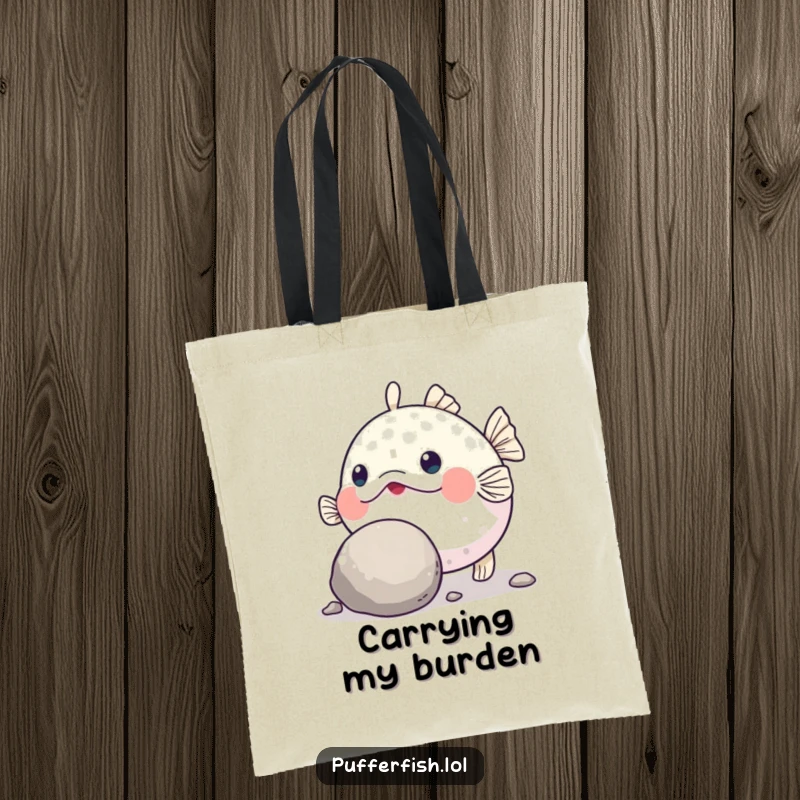Funny Pufferfish Grit Tote Bag: A durable tote bag showing a determined pufferfish humorously pushing a large, round pebble with its nose.